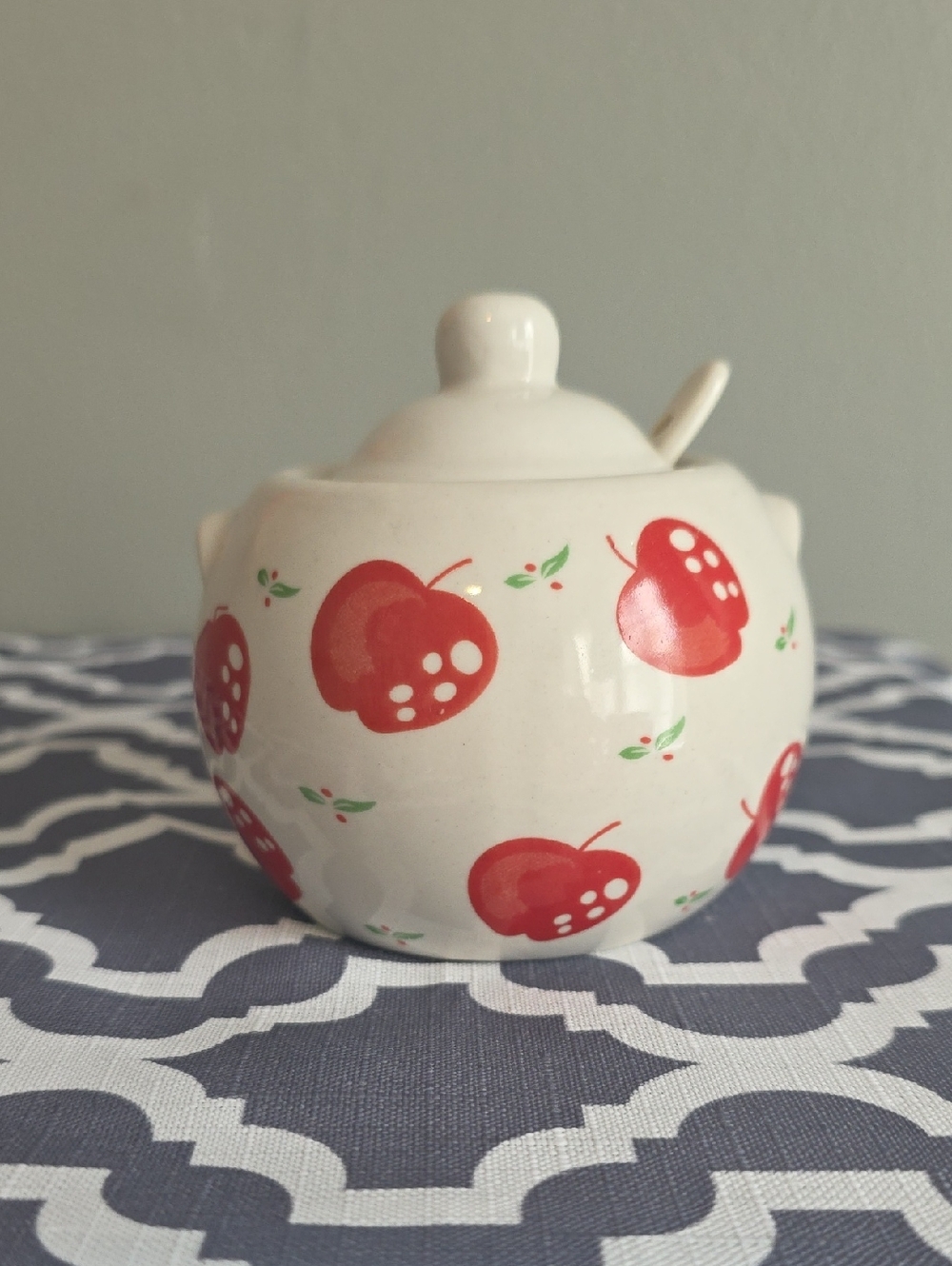 White Ceramic Sugar Jar with Red Apple Motif and Spoon